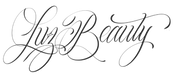 Calligraphic text 'Luz Beauty' on a white background